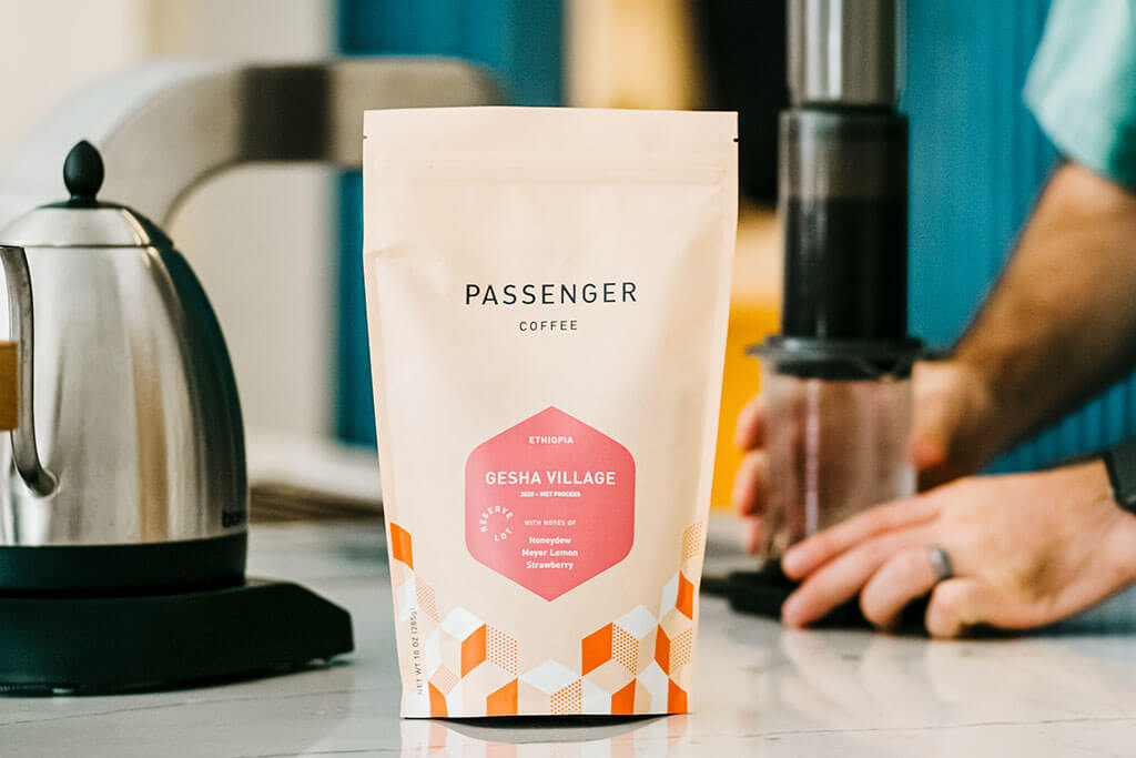 a bag of Passenger coffee with newly designed packaging designed by Infantree