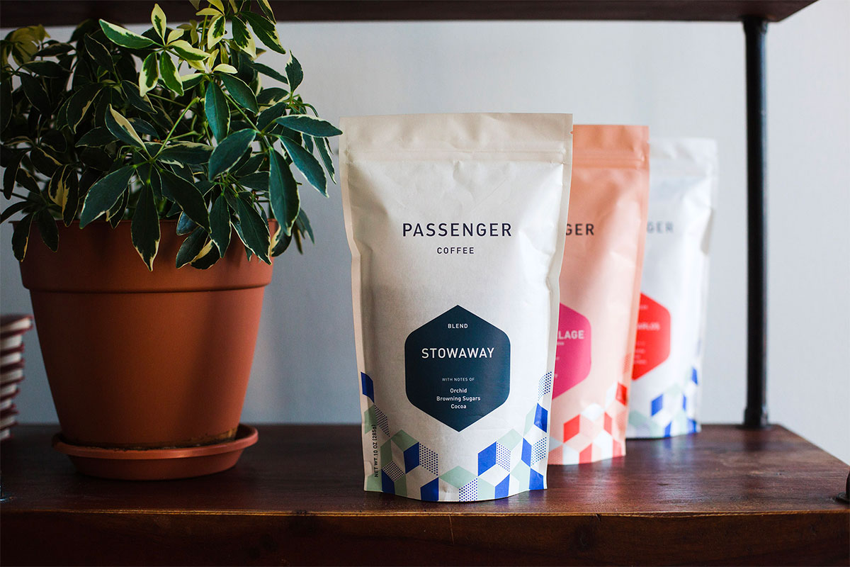 close-up of redesigned Passenger Coffee bags with bright, geometric patterns